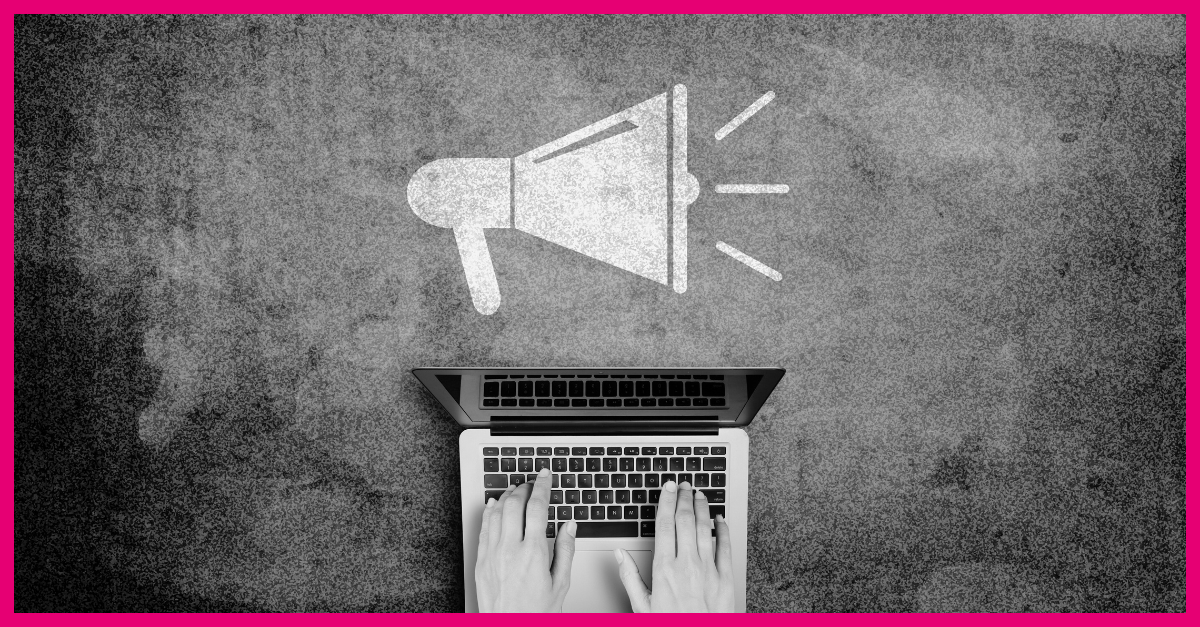 Image of a pair of hands typing on a laptop